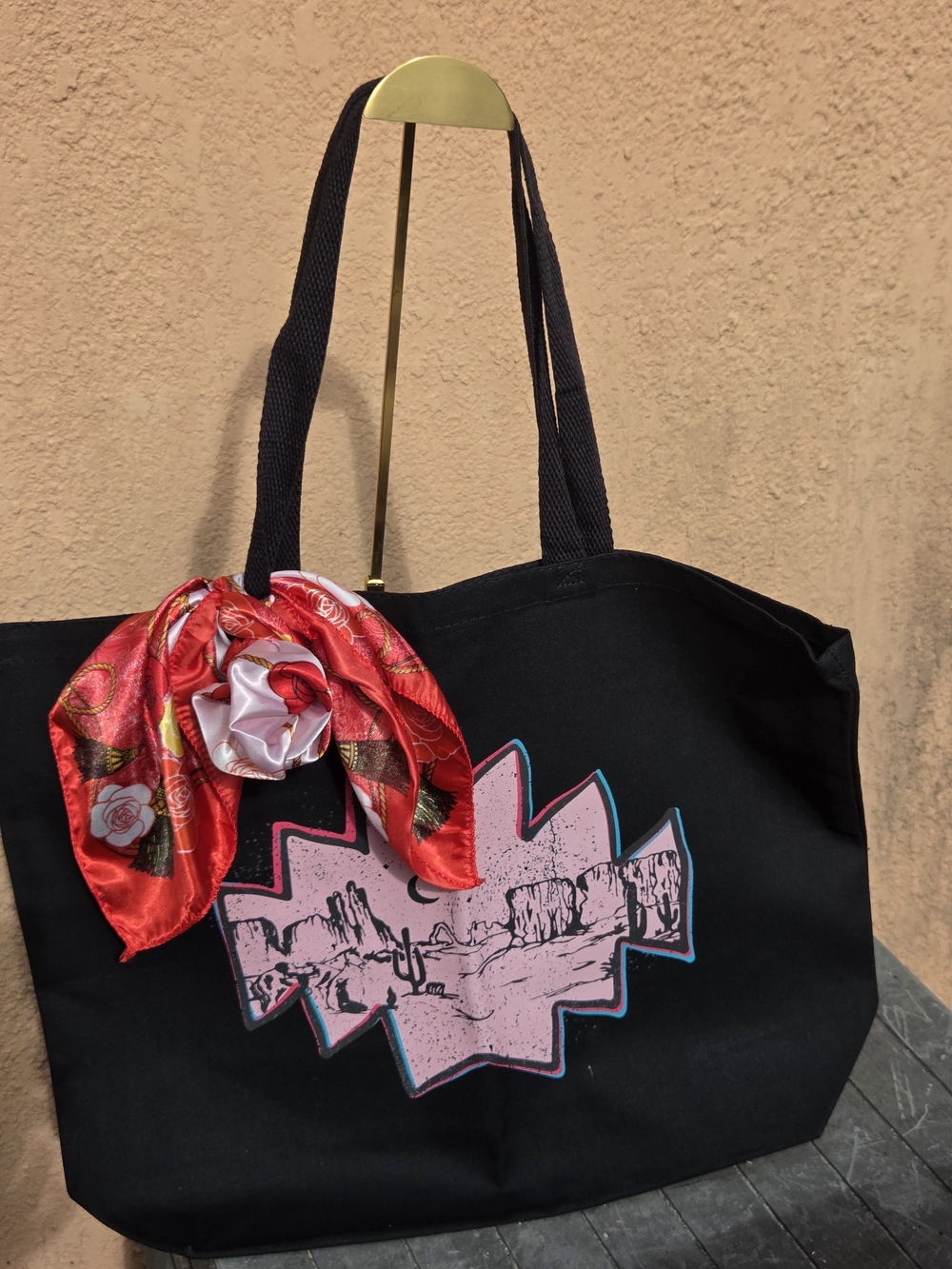 Stylish Black Tote Bag with Pink Desert Graphic and Red Scarf